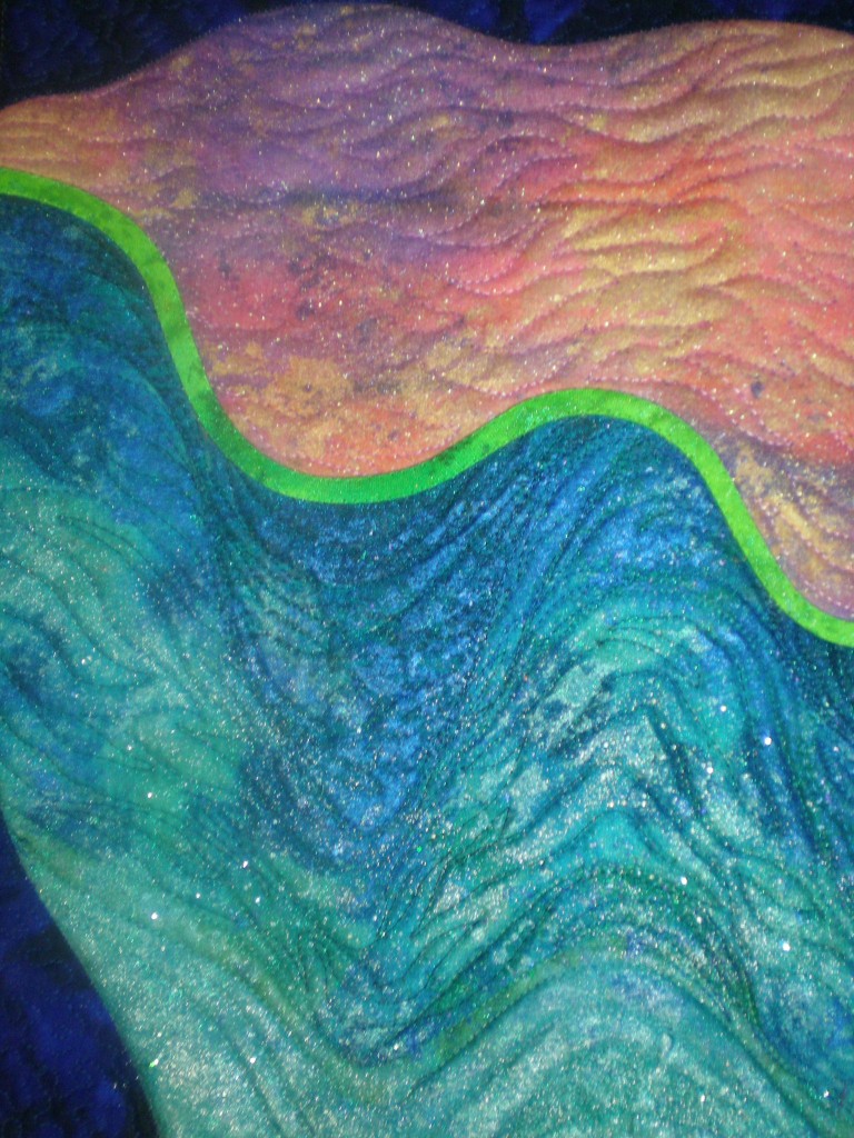 Detail shot, quilt study by Beth Ann Williams, inspired by Dale Chihuly's Macchia Bowls. A variety of fabric paints were used on top of a collage of commercial fabrics to help recreate the soft undulations and glow of the glass macchia bowls.