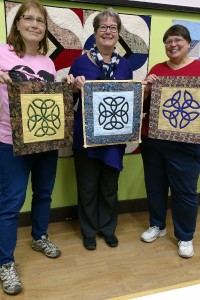 Susan, Jan, and Carolyn with their Celtic True Lover's Knots from the Celtic Quilts book by Beth Ann Williams